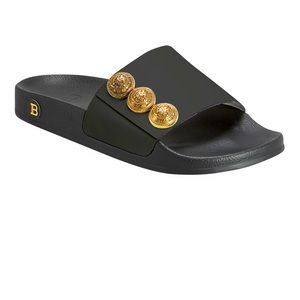 Balmain "Symi" leather sandals with golden button trim.